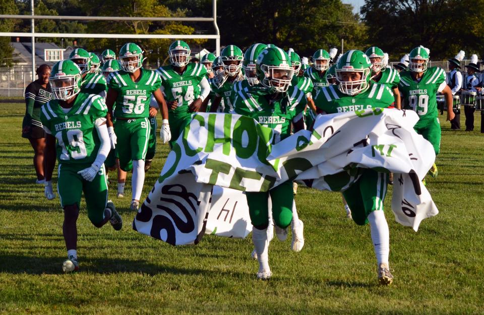 The South Hagerstown football team storms the field to kick off its 2023 season at home against Century.