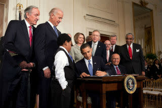 President Obama signs the Affordable Care Act