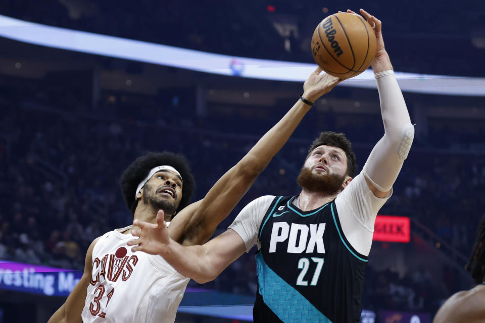 Portland Trail Blazers center Jusuf Nurkic (27) grabs a rebound against Cleveland Cavaliers center Jarrett Allen (31) during the first half of an NBA basketball game, Wednesday, Nov. 23, 2022, in Cleveland. (AP Photo/Ron Schwane)