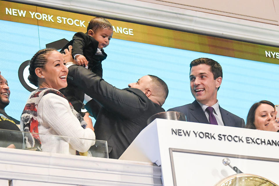 <p>At the New York Stock Exchange, Khaled held up his <a rel="nofollow" href="https://www.yahoo.com/celebrity/dj-khaleds-baby-winning-instagram-174725084.html" data-ylk="slk:social media-savvy;elm:context_link;itc:0;sec:content-canvas;outcm:mb_qualified_link;_E:mb_qualified_link;ct:story;" class="link  yahoo-link">social media-savvy</a> baby boy, 7-and-a-half-month-old Asahd, at the opening bell ceremony to promote Get Schooled’s “Keys to Success” campaign. Of course, fiancée Nicole Tuck was there, too. (Photo: Mike Coppola/Getty Images) </p>