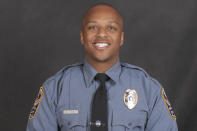 This undated photo provided by the Gwinnett County Police Department on Saturday, Oct. 20, 2018 shows Officer Antwan Toney. On Saturday, Toney was killed after being shot while responding to a suspicious vehicle parked near a middle school. (Gwinnett County Police Department via AP)