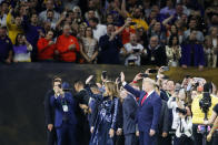 President Donald Trump and first lady Melania Trump attend the NCAA College Football Playoff national championship game Monday, Jan. 13, 2020, in New Orleans. (AP Photo/Gerald Herbert)