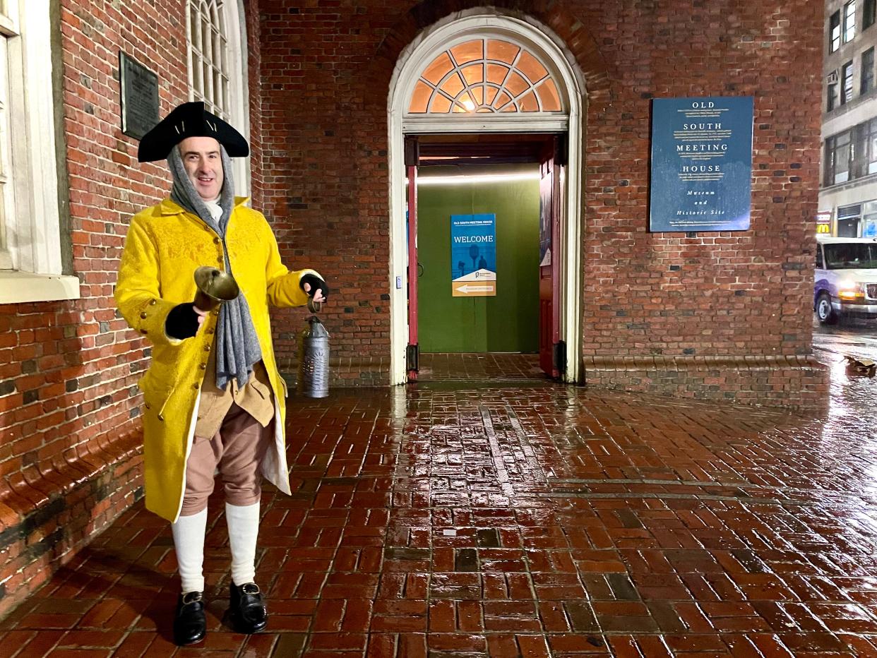 A town crier calls a meeting outside Boston’s Old South Meeting House.