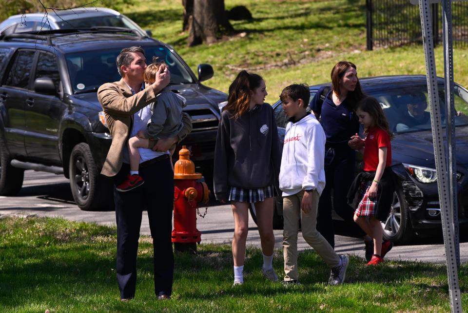 A family leaves with their children from a reunification site in Nashville, Tenn., Monday, March 27, 2023. Officials say several children were killed in a shooting at Covenant School in Nashville. (AP)