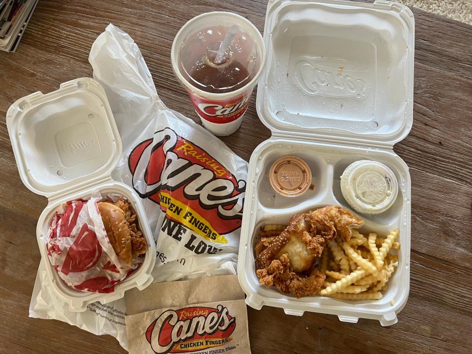 Raising Cane's chicken tenders and sandwich in packaging