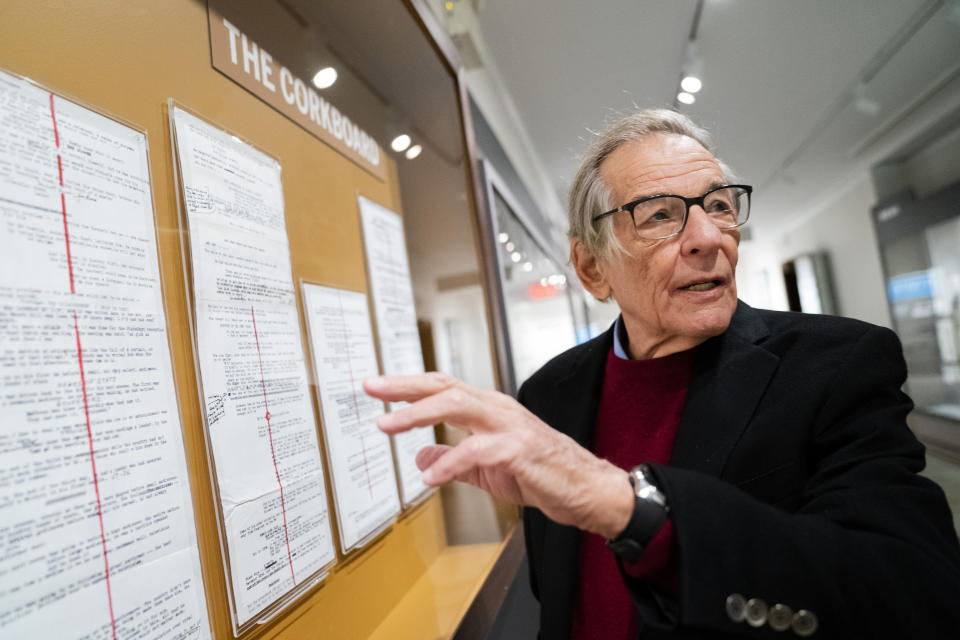 Author and biographer Robert Caro stands next to his written outlines while touring a permanent exhibit in his honor, "Turn Every Page": Inside the Robert A. Caro Archive, at the New York Historical Society Museum & Library in New York on Wednesday, Oct. 20, 2021. (AP Photo/John Minchillo)