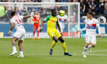 Soccer Football - Ligue 1 - Olympique Lyonnais v FC Nantes - Groupama Stadium, Lyon, France - April 28, 2018 Nantes' Koffi Djidji in action with Lyon's Memphis Depay REUTERS/Emmanuel Foudrot