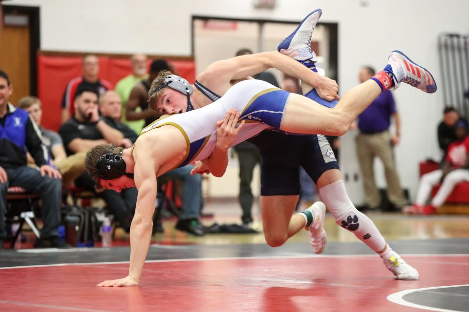 Nick Sanko of Pittsford takes down Ethan Fargo of Webster Schroeder in the Section V Class A1 145-pound championship at Hilton High School on Feb. 8.