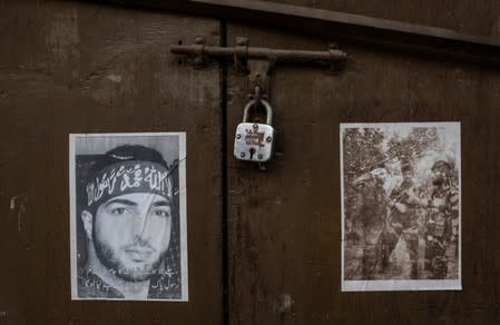 The Wider Image: Barricades and books in restive Kashmir neighbourhood