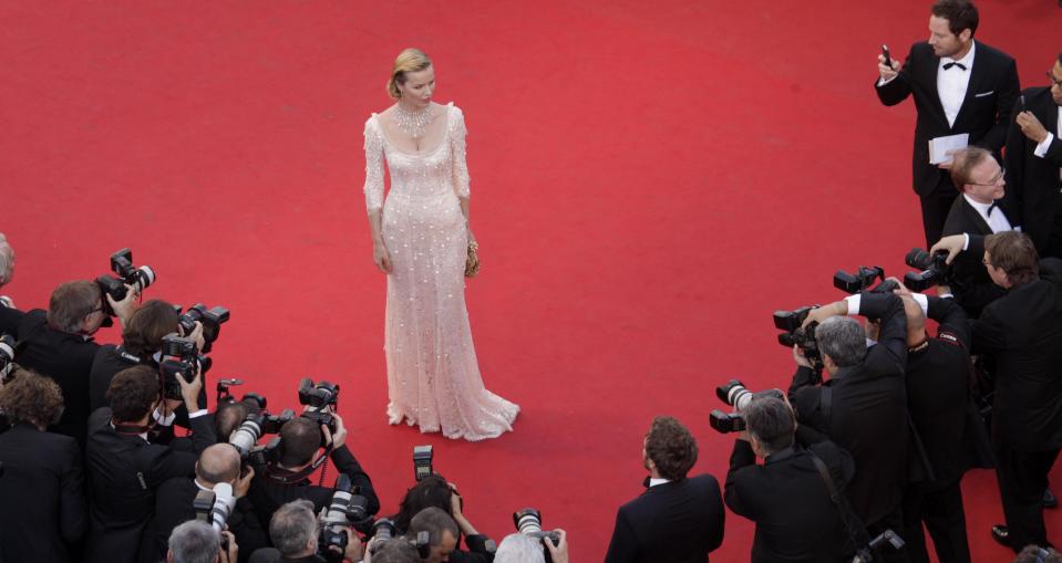 Model Eva Herzigova poses for photographers during the opening ceremony and screening of Moonrise Kingdom at the 65th international film festival, in Cannes, southern France, Wednesday, May 16, 2012. Herzigova is wearing a dress by Dolce & Gabbana. (AP Photo/Virginia Mayo, Pool)