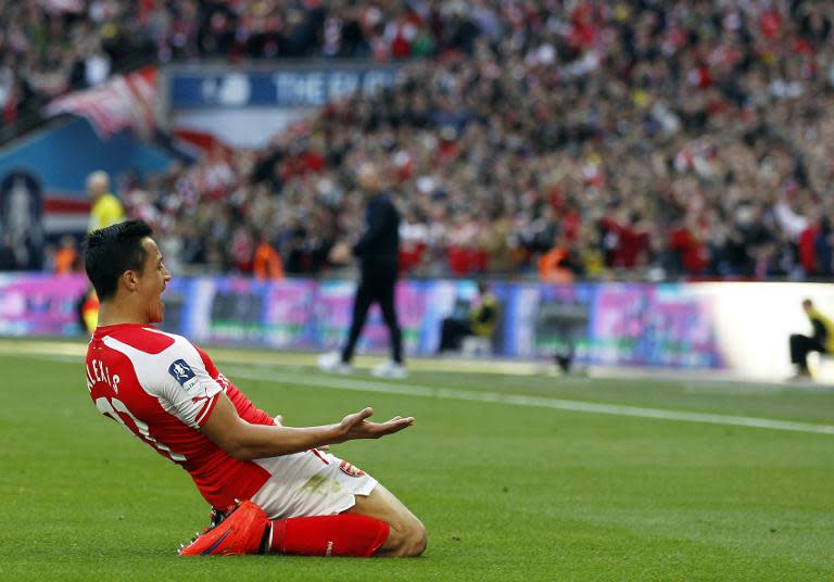 Arsenal's Alexis Sanchez celebrates after scoring during the FA Cup semi-final against Reading at Wembley stadium on April 18, 2015
