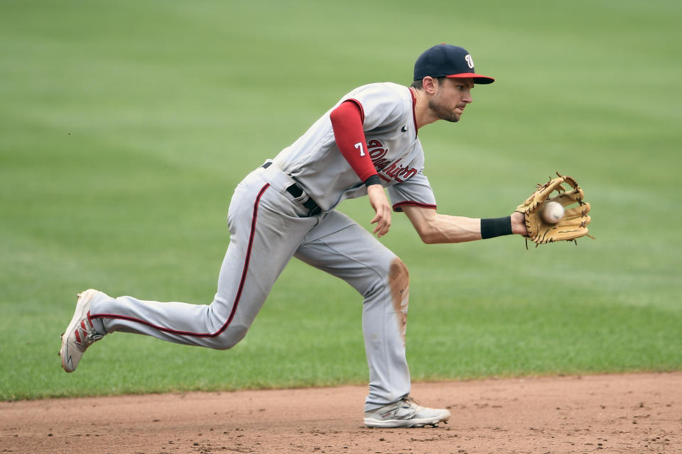 Washington Nationals shortstop Trea Turner fields a grounder by Baltimore Orioles' Trey Mancini during the sixth inning of a baseball game, Sunday, July 25, 2021, in Baltimore. Mancini was out at first on the play. (AP Photo/Nick Wass)