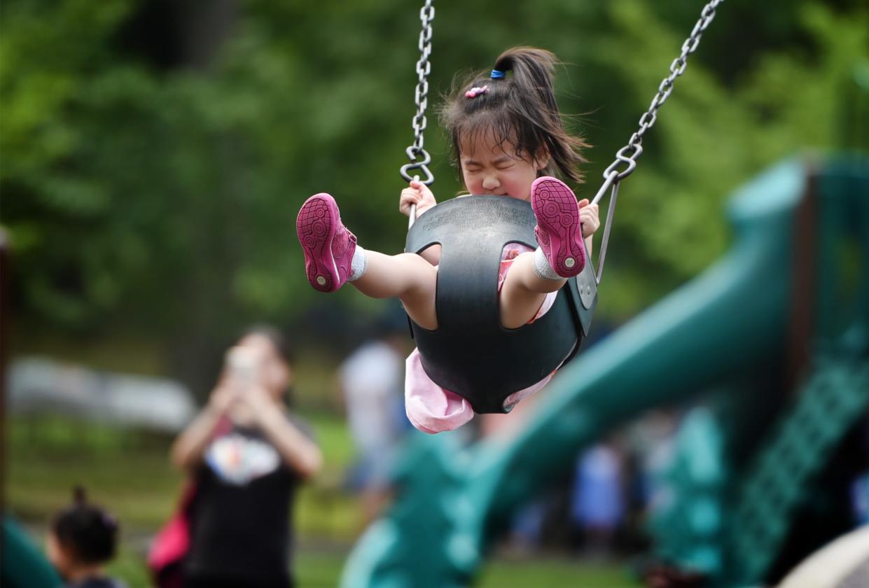 A little girl rides on a swing at Van Saun County Park in Paramus on 07/07/19.