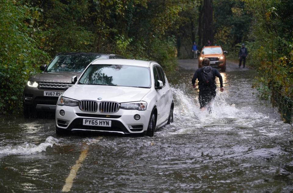 A broken down car in floodwater near Derwentwater, Keswick, in Cumbria (Owen Humphreys/PA) (PA Wire)