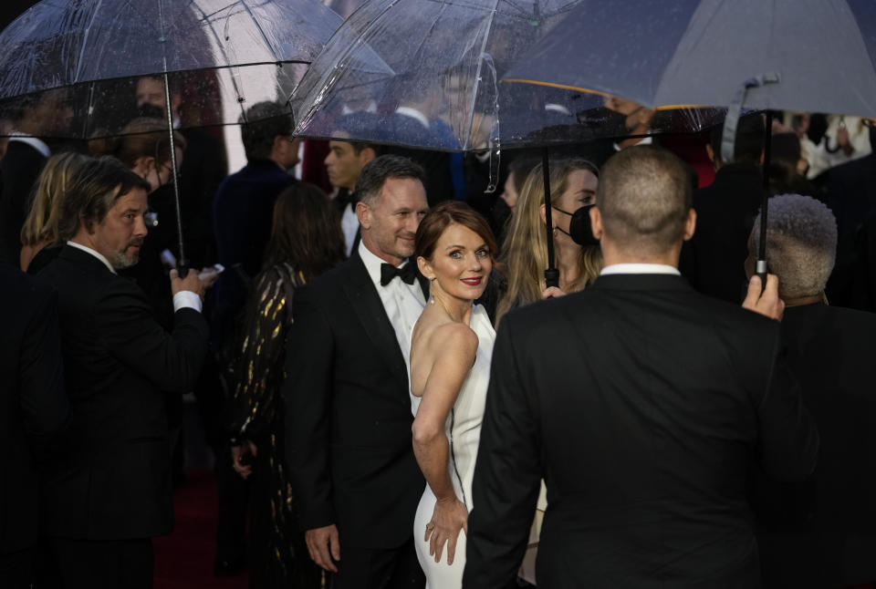 Geri Halliwell, centre, poses for photographers upon arrival for the World premiere of the new film from the James Bond franchise 'No Time To Die', in London Tuesday, Sept. 28, 2021. (AP Photo/Matt Dunham)