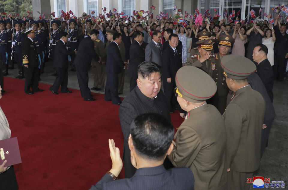 This Sunday, Sept. 10, 2023, photo provided by the North Korean government, shows that North Korea leader Kim Jong Un greets attendants in Pyongyang, North Korea, before boarding a train to Russia. Independent journalists were not given access to cover the event depicted in this image distributed by the North Korean government. The content of this image is as provided and cannot be independently verified. Korean language watermark on image as provided by source reads: "KCNA" which is the abbreviation for Korean Central News Agency. (Korean Central News Agency/Korea News Service via AP)