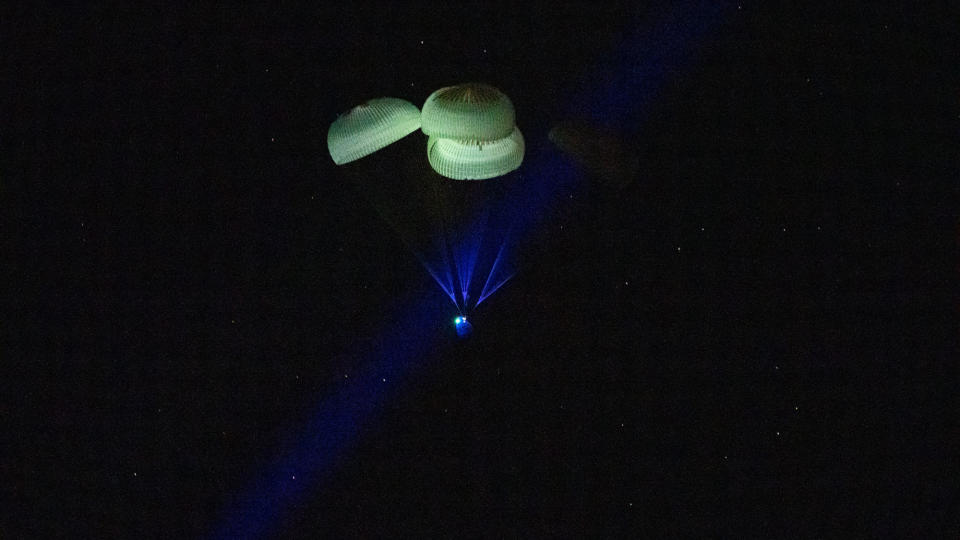 The SpaceX Crew-5 Dragon Endurance capsule is descends to Earth under parachutes as it splashes down in the Gulf of Mexico off the coast of Tampa Bay, Florida on March 11, 2021, returning four astronauts to Earth after 5 months.
