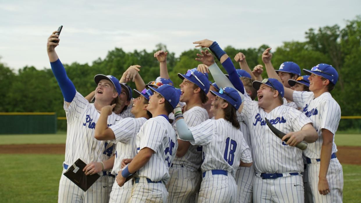 Simon Kenton's Logan Cones takes a selfie with his teammates after the Pioneers defeated Walton-Verona 10-7 in the 32nd District championship game on Tuesday, May 16.
