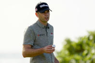 Brendan Steele acknowledges the gallery on the 16th green during the second round of the Sony Open PGA Tour golf event, Friday, Jan. 10, 2020, at Waialae Country Club in Honolulu. (AP Photo/Matt York)