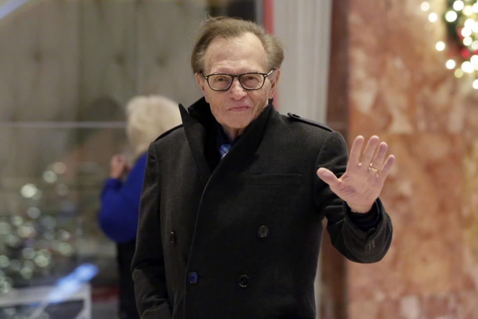 Larry King waves while arriving at Trump Tower in New York on Dec. 1, 2016.