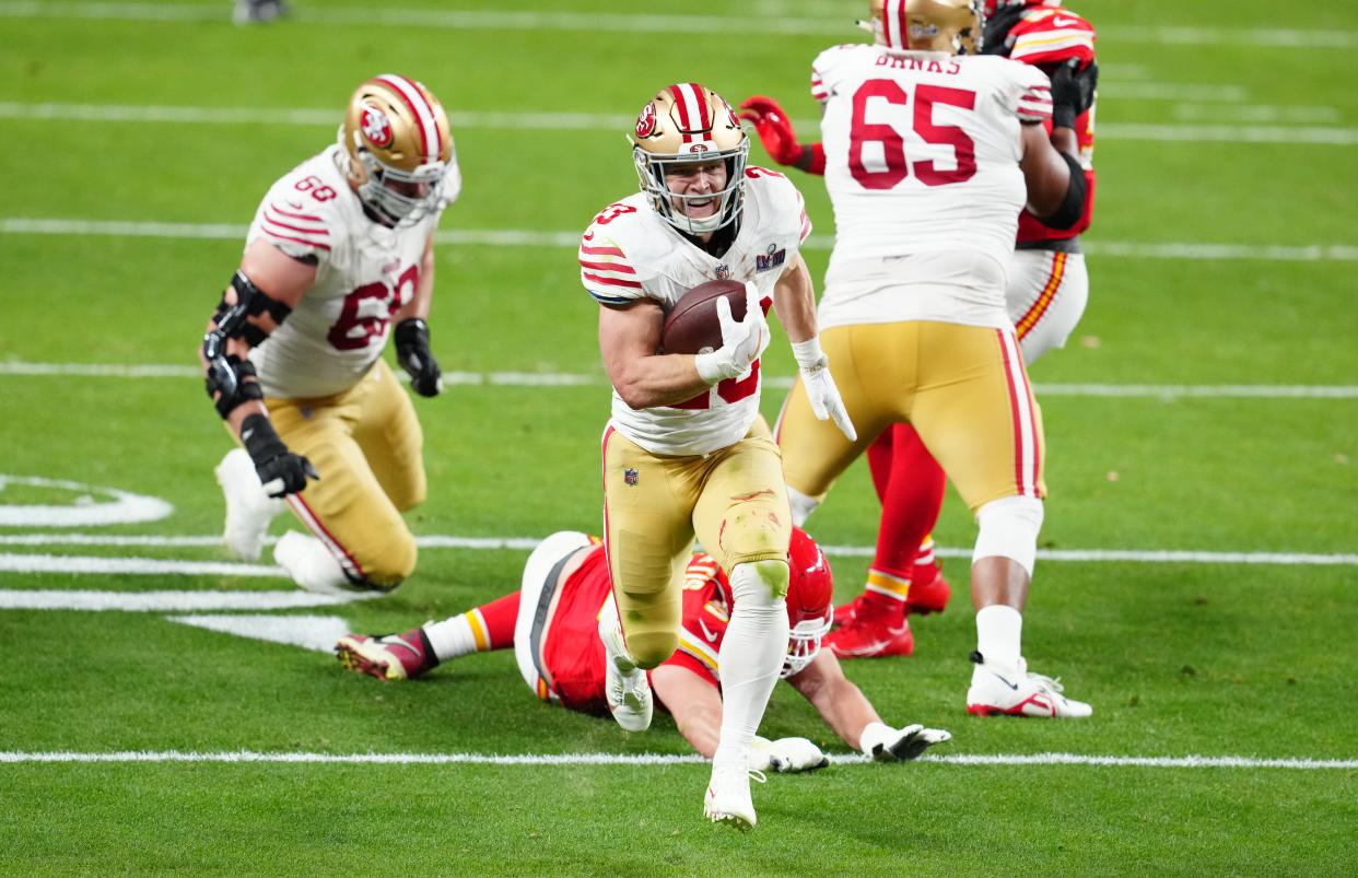 San Francisco 49ers running back Christian McCaffrey scores a touchdown against the Kansas City Chiefs in Super Bowl 58.