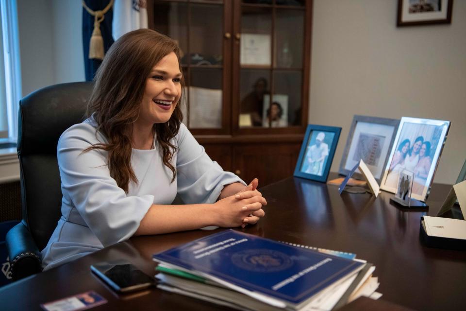 Washington, DC  --  Rep. Abby Finkenauer, D-Iowa, sits surrounded by photos of her friends and family and other mementos including Michelle Obama's book in her office on Capitol Hill on June 27, 2019. The moderate Democrat is the only freshman to chair a subcommittee, and is the second-youngest person to serve in Congress. --    Photo by Hannah Gaber, USA TODAY