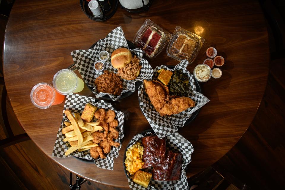 Fried shrimp with fries and cornbread, smoked chicken sandwich with baked beans, fried flounder with greens and cornbread, and BBQ pork ribs with mac & cheese and cornbread from Melvin's at Riverside restaurant at 1130 Person St.