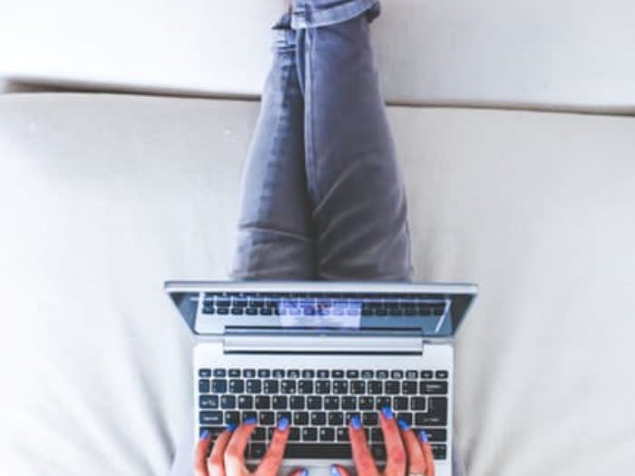 hands-woman-legs-laptop