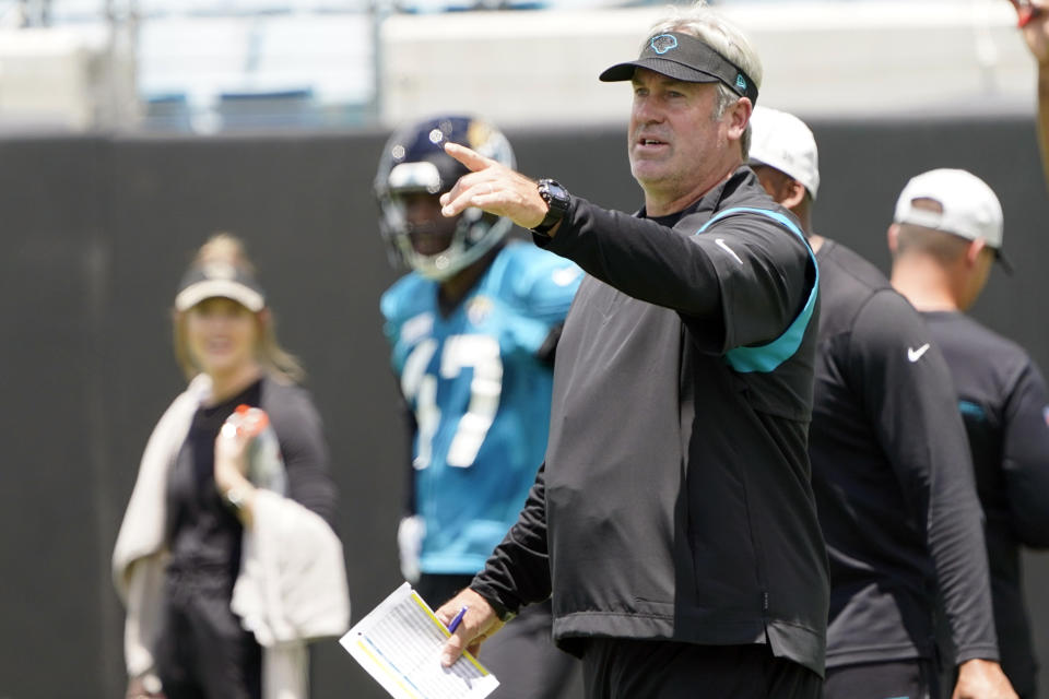 Jacksonville Jaguars head coach Doug Pederson directs players during an NFL football rookie minicamp, Friday, May 13, 2022, in Jacksonville, Fla. (AP Photo/John Raoux)