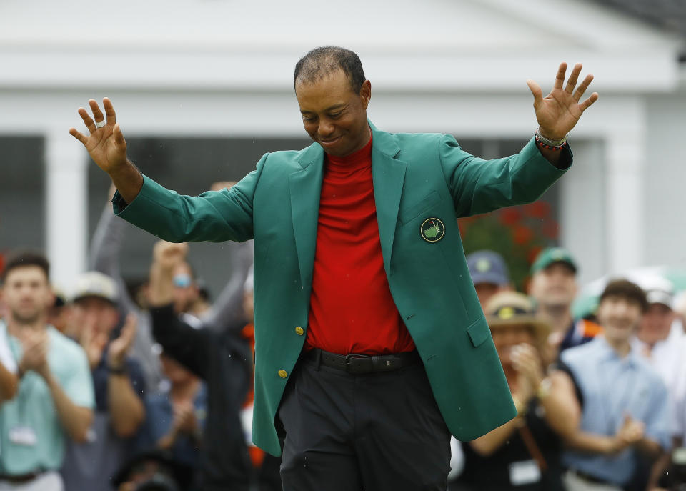 FILE - In this April 14, 2019, file photo, Tiger Woods smiles as he wears his green jacket after winning the Masters golf tournament in Augusta, Ga. Fourteen years after his last Masters win and 11 years after his last major, after fighting through chronic back problems, multiple surgeries, a bout with painkillers and long after just about everybody had written him off, Woods claimed his fifth green jacket. (AP Photo/Matt Slocum, File)