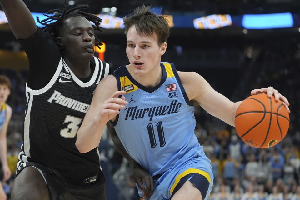 Marquette's Tyler Kolek tries to get past Providence's Garwey Dual during the first half of an NCAA college basketball game Wednesday, Feb. 28, 2024, in Milwaukee. (AP Photo/Morry Gash)