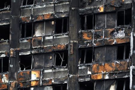 Damage to Grenfell Tower is seen following the catastrophic fire, in north Kensington, London, Britain, June 25, 2017. REUTERS/Peter Nicholls