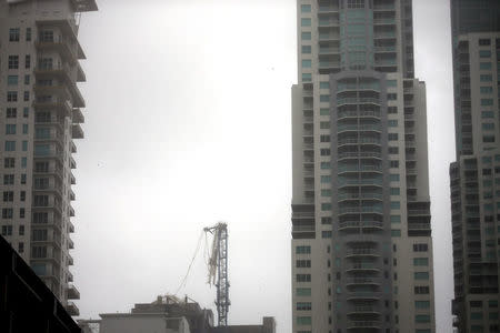 A collapsed construction crane is seen in Downtown Miami as Hurricane Irma arrives at south Florida, September 10, 2017. REUTERS/Carlos Barria