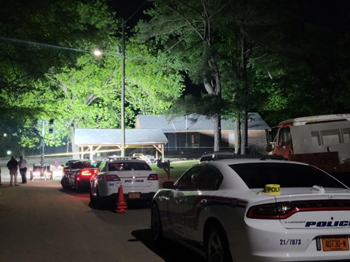 Patrol cars line up outside a home on Alphin Street where one person was killed and two others injured in a home invasion shooting on Tuesday, April 18, 2023. April McLucas, 39, was arrested in the shooting on May 3, police said Wednesday.