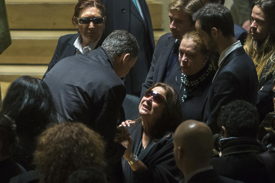 Spain's Crown Prince Felipe, center left, speaks with Casilda Varela, the former wife of Paco de Lucia, centre right, de Lucia's wake in the National Auditorium in Madrid, Spain, Friday, Feb. 28, 2014. De Lucia, one of the world's greatest guitarists who dazzled audiences with his lightning-speed flamenco rhythms and finger work, died in Mexico on Wednesday, Feb. 26 aged 66. (AP Photo/Andres Kudacki)