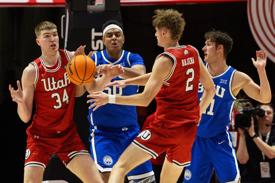 From left, Utah Utes center Lawson Lovering (34), Brigham Young Cougars center Aly Khalifa (50), Utah Utes guard Cole Bajema (2) and Brigham Young Cougars guard Trevin Knell (21) during a men’s basketball game at the Jon M. Huntsman Center in Salt Lake City on Saturday, Dec. 9, 2023. | Megan Nielsen, Deseret News