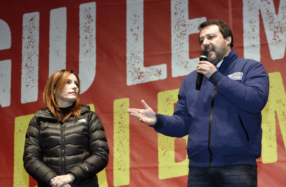 Matteo Salvini of the League speaks to supporters during a campaign event in Bibbiano, Emilia-Romagna, Italy, as Northern League Senator Lucia Borgonzoni listens on Thursday, Jan. 23, 2020. (Stefano Cavicchi/LaPresse via AP)