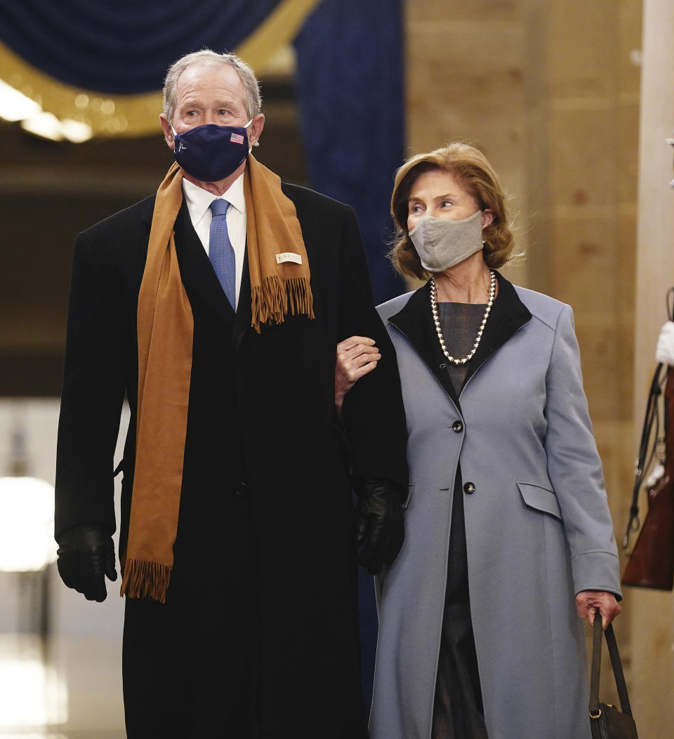 Former President George W. Bush and Laura Bush arrive in the Crypt of the US Capitol for President-elect Joe Biden's inauguration ceremony on Wednesday, Jan. 20, 2021 in Washington. (Jim Lo Scalzo (Jim Lo Scalzo/Pool Photo via AP)