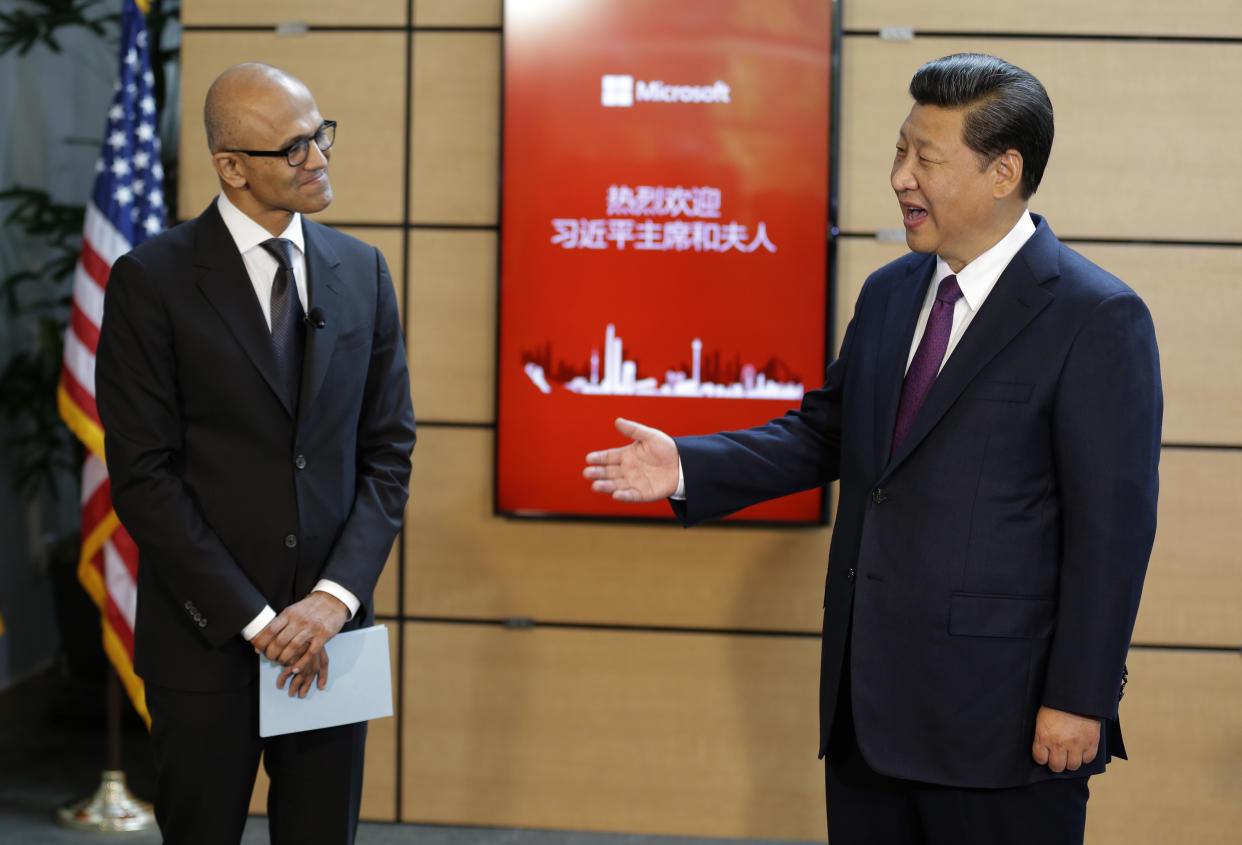 REDMOND, WA - SEPTEMBER 23: Chinese President Xi Jinping (R) talks with Microsoft CEO Satya Nadella (L) during a tour of the main campus of Microsoft September 23, 2015  in Redmond, Washington. Xi and top executives from U.S. and Chinese companies discussed a range of issues, including trade relations, intellectual property protection, regulation transparency and clean energy, according to published reports.  (Photo by Ted S. Warren-Pool/Getty Images)