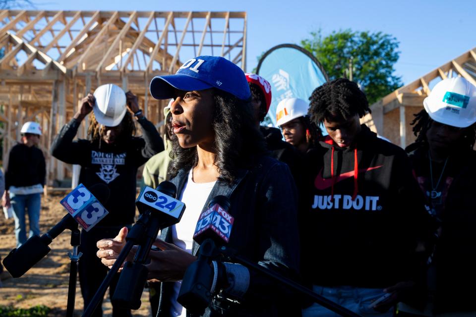 Memphis-Shelby County Schools Superintendent Marie Feagins speaks to the press with MSCS students behind her before they begin helping to build homes with Habitat for Humanity in Memphis, Tenn., on Friday, April 5, 2024.