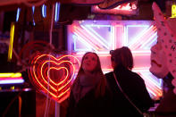 <p>Visitors look at the neon signs and artworks in God’s Own Junkyard gallery and cafe in London, Britain, March 31, 2017. (Photo: Russell Boyce/Reuters) </p>