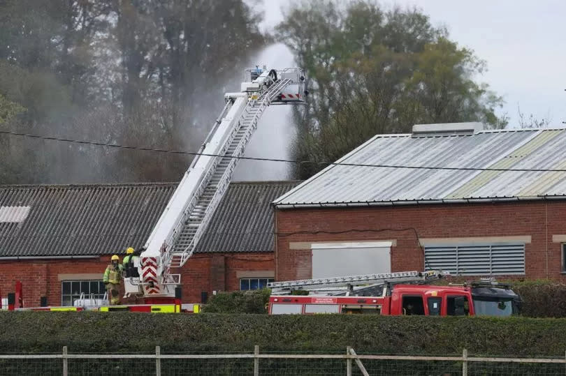 Firefighters damping down after a huge fire at Synthite in Mold