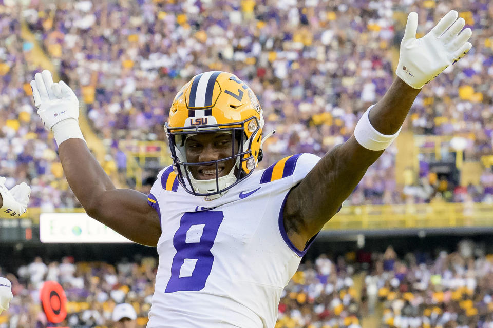 FILE - LSU wide receiver Malik Nabers (8) celebrates after a touchdown by teammate Brian Thomas Jr. against Grambling State during an NCAA college football game in Baton Rouge, La., Saturday, Sept. 9, 2023. Nabers is a possible first round pick in the NFL Draft.(AP Photo/Matthew Hinton, File)