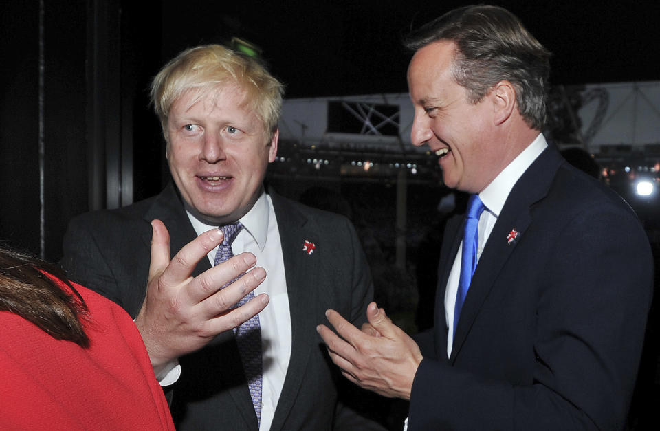 Britain's Prime Minister David Cameron, right, and Mayor of London Boris Johnson chat prior to the Opening Ceremony of the 2012 Olympic Summer Games at the Olympic Stadium, London, Friday, July 27, 2012. (AP Photo/John Stillwell, pool)
