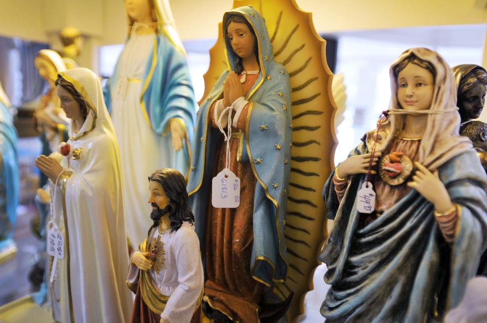 Figures of religious icons were among items for sale at the Queen of Angels Catholic Store in this 2012 photo. The store, which was sold to a new owner in 2017 and now operates on San Jose Boulevard in Mandarin, is suing to challenge Jacksonville's human rights ordinance as an infringement on religious and free-speech rights.(Photo: Bob Self/Florida Times-Union)