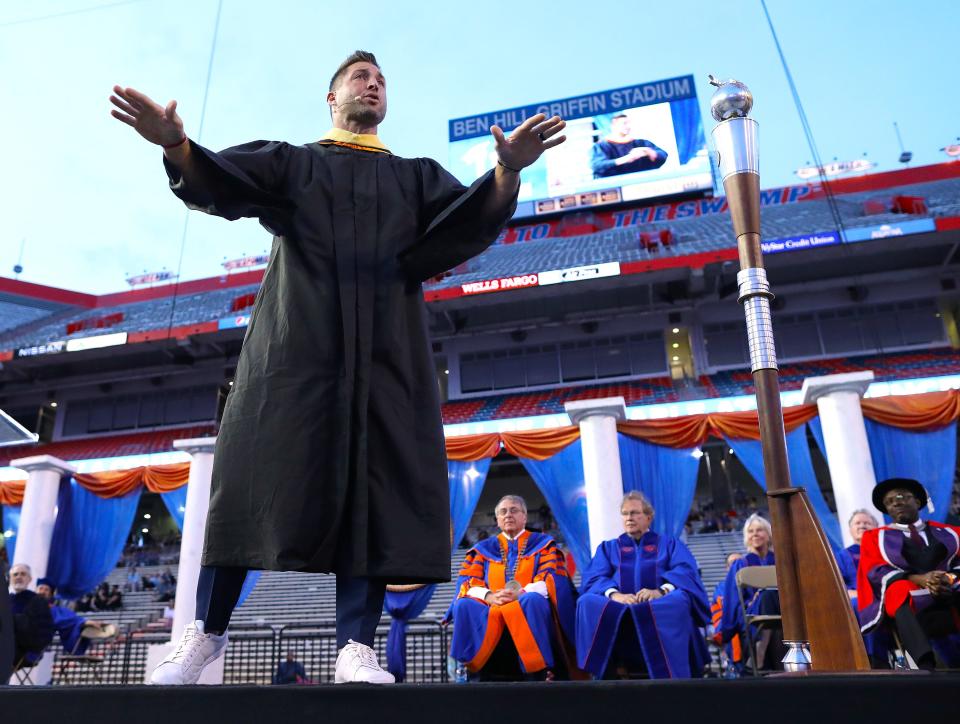 University of Florida great Tim Tebow delivers the commencement address during Spring 2022 Commencement Ceremony being held at Ben Hill Griffin Stadium, in Gainesville Fla. April 29, 2022. Florida Gators great Tim Tebow was the commencement speaker. He talked about not just being successful, but being sure that you were being significant.  [Brad McClenny/The Gainesville Sun]   