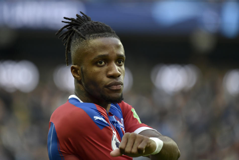 Crystal Palace's Wilfried Zaha reacts during the English Premier League soccer match between Manchester City and Crystal Palace at Etihad stadium in Manchester, England, Saturday, Jan. 18, 2020. (AP Photo/Rui Vieira)
