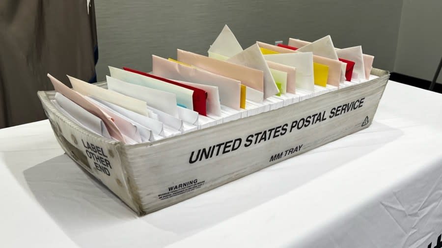 USPS sorting box on display at announcement of mail theft arrests