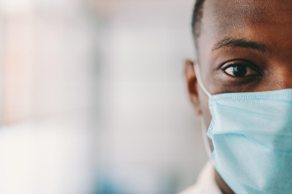 Man wearing protective face mask for safety  during COVID-19