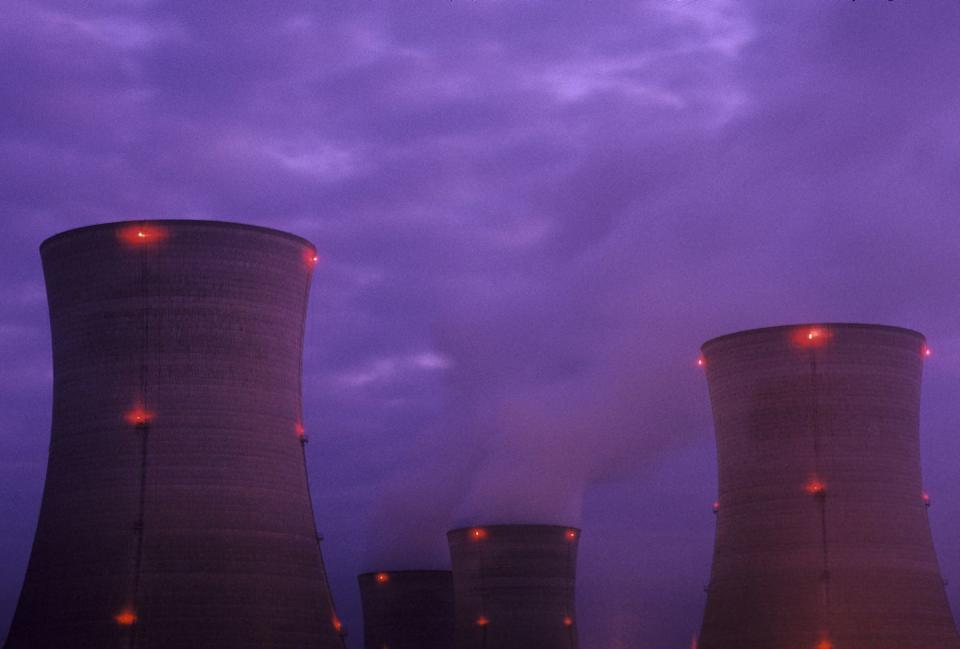 the cooling towers of the damaged three mile island nuclear plant glow at dusk photo by karen kasmauskicorbis via getty images